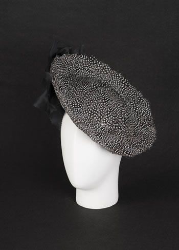 Buntal hat with guinea fowl feathers and hand made silk orchides