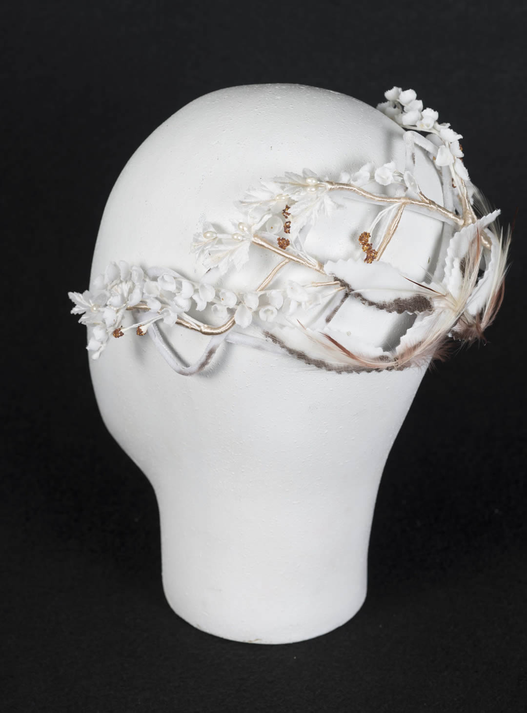 Wired fascinator with flowers, stamens, velvet leaves and bird of paradise feathers