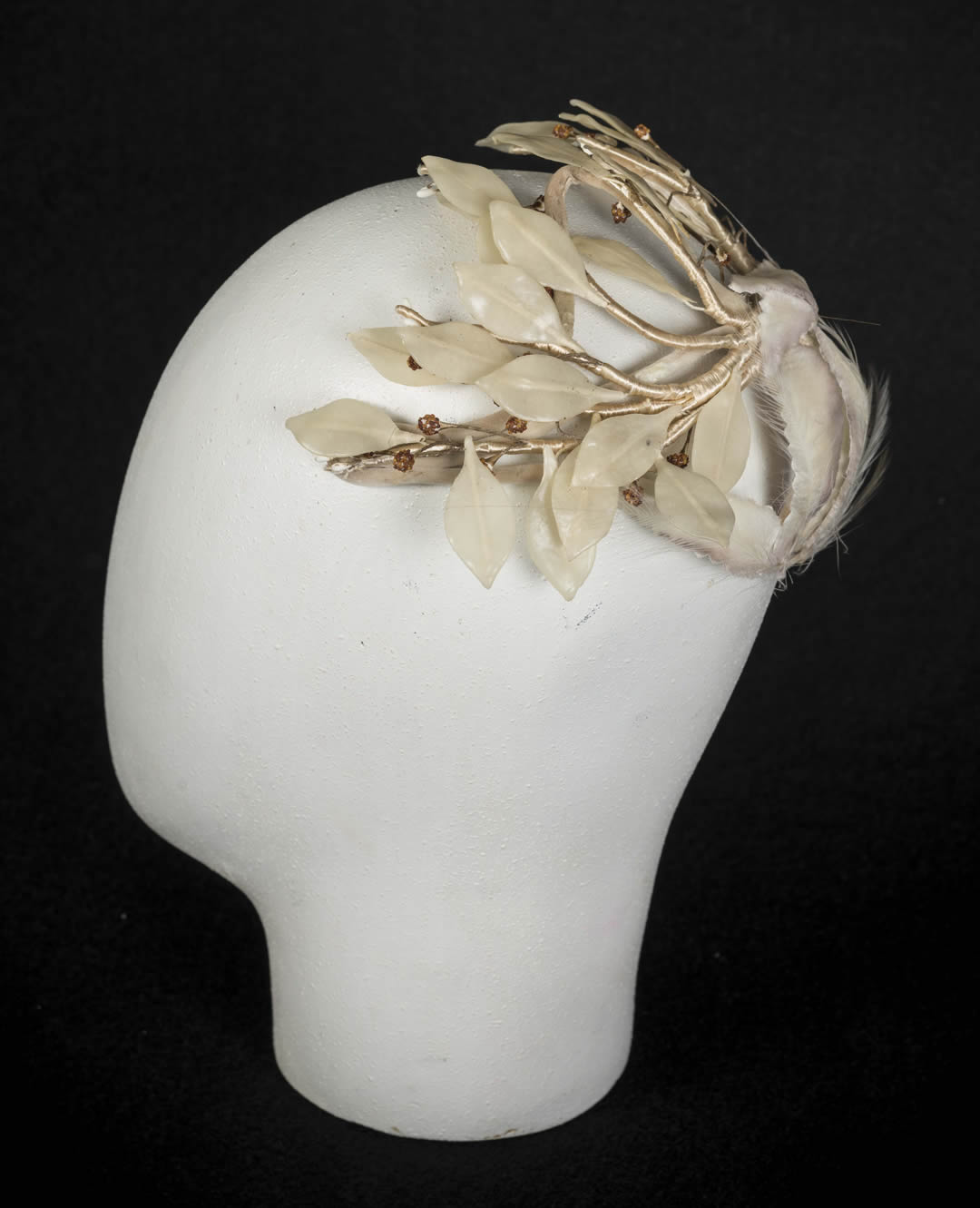 Wired fascinator with stamens, wax leaves, velvet leaves and bird of paradise feathers