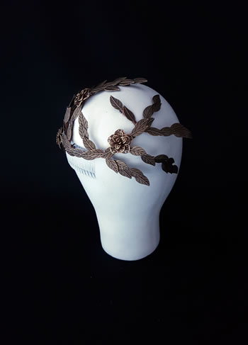 Wired fascinator with metallic leaves